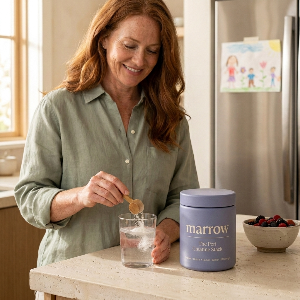 Woman scooping MARROW lavender jar creatine into water in a kitchen